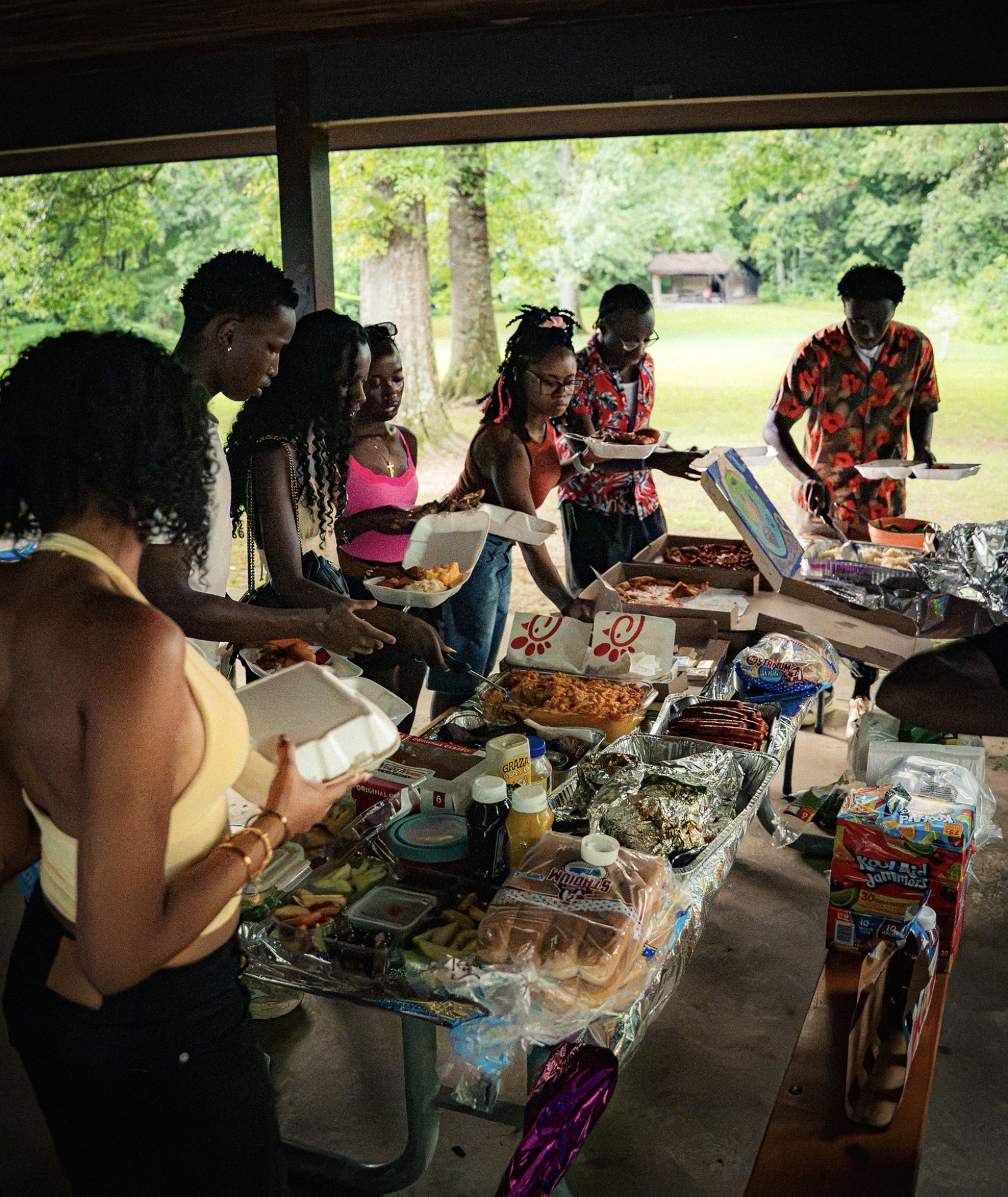 Friends share a Summer Bash food spread